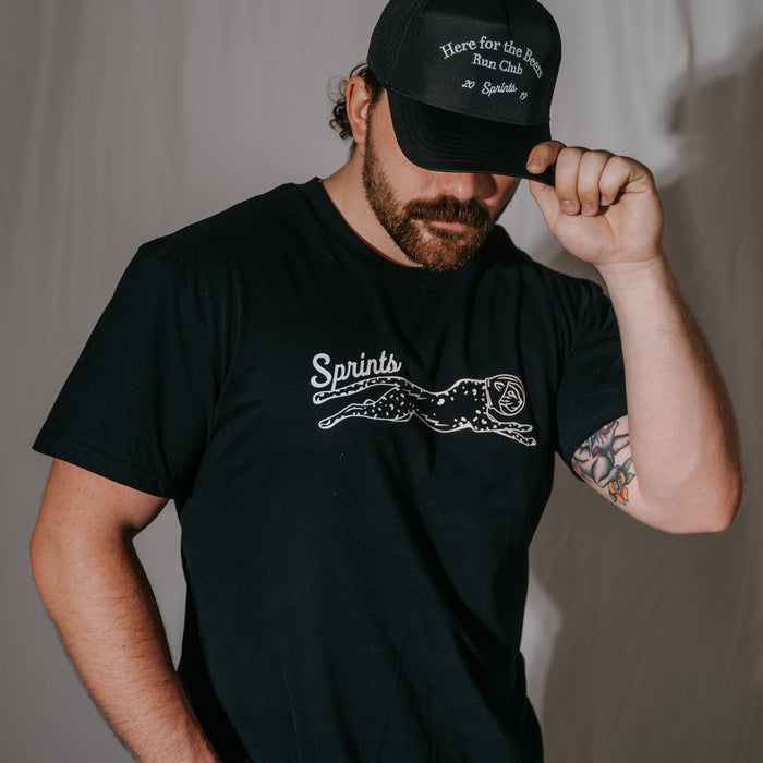 Person wearing the Victory Sprints Luxe Suprima Cotton Tee in Black