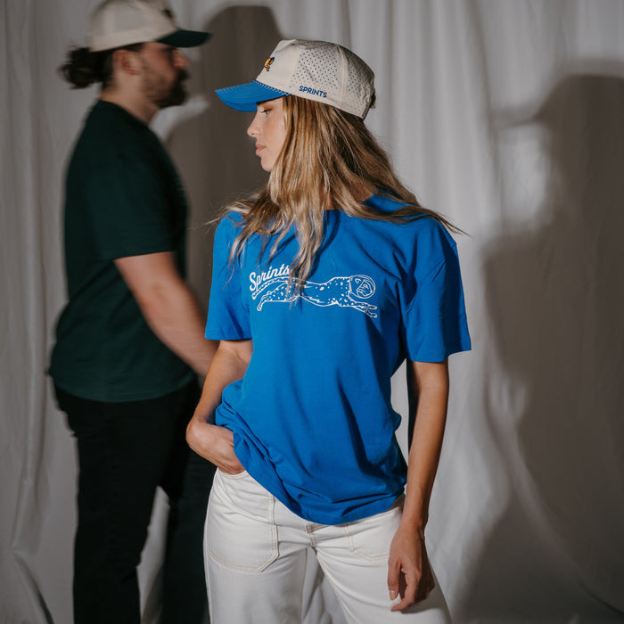 Person wearing the Victory Sprints Luxe Suprima Cotton Tee in Blue