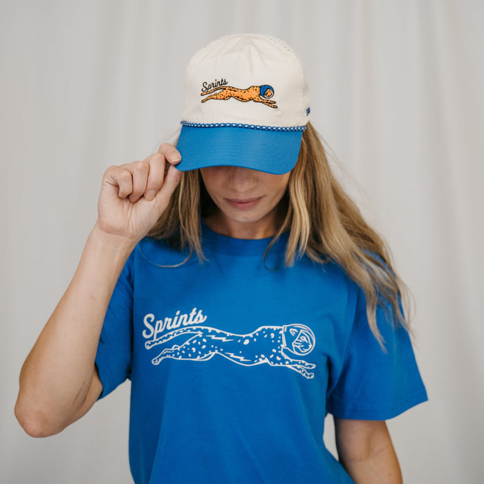 Person wearing the Victory Sprints Luxe Suprima Cotton Tee in Blue, close-up