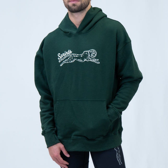 Person wearing the Victory Sprints Oversized Hoodie in Green Label