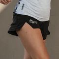 Woman wearing the Avigate 4 inch Mercy Short in NYC City of Dreams print