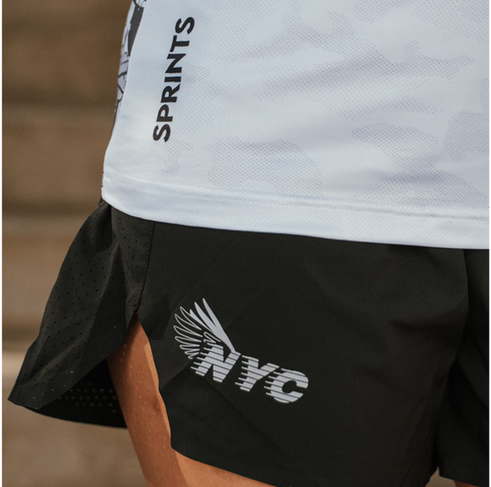 Woman wearing the Avigate 4 inch Mercy Short in NYC City of Dreams print, close-up