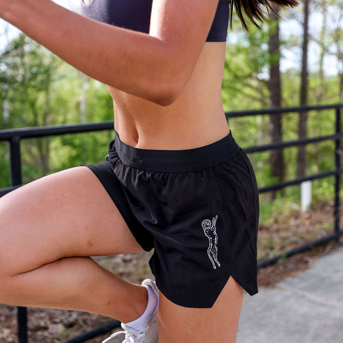 Woman wearing the Avigate 4 inch Mercy Short in Stealth Black, side view