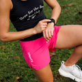 Woman wearing the Avigate 4 inch Mercy Short in Stealth Fuchsia