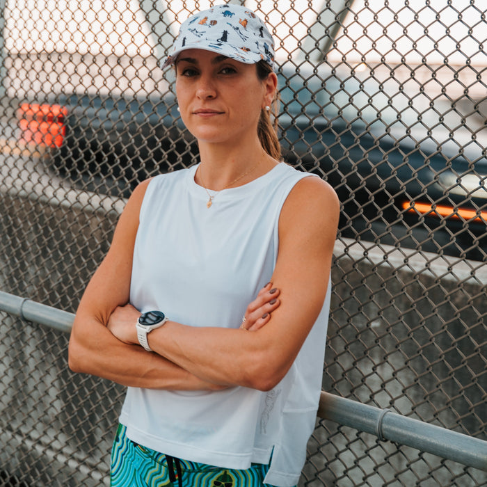 Woman wearing the Core Zero Framework Tank in Stealth White
