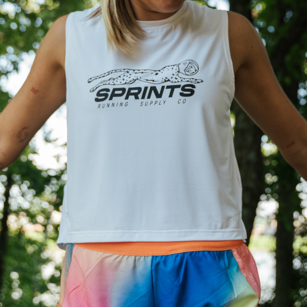 Woman wearing the Core Zero Framework Tank in Velocity Sprints White, side view