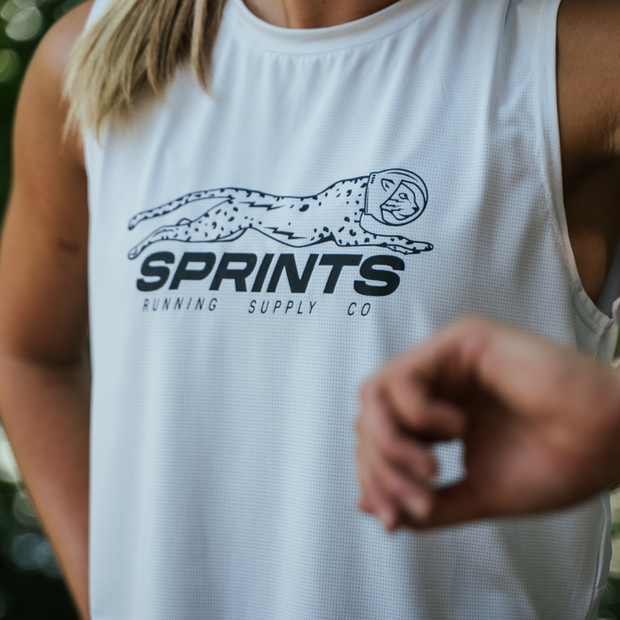 Woman wearing the Core Zero Framework Tank in Velocity Sprints White, close-up