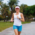 Woman wearing the Core Zero Running Tank in Stealth White