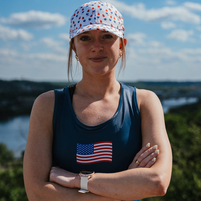 Woman wearing the Womens Core Zero Running Tank, USA Navy
