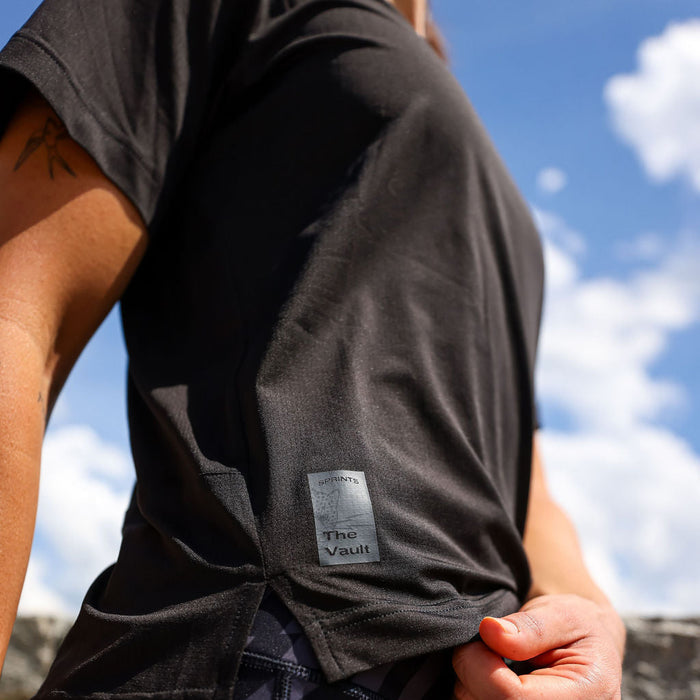 Woman wearing the Core Zero Tech Tee in Vault Jag Black, close-up