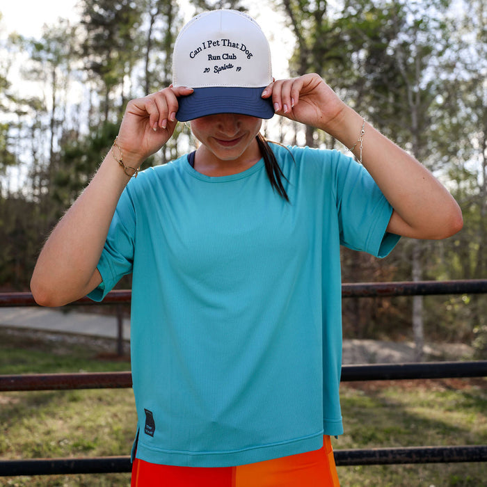 Woman wearing the Core Zero Tech Tee in Vault Jag Teal