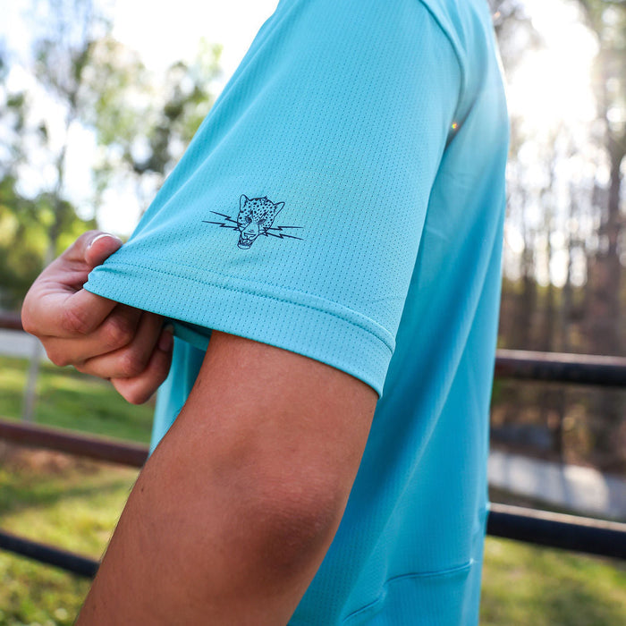 Woman wearing the Core Zero Tech Tee in Vault Jag Teal, side view