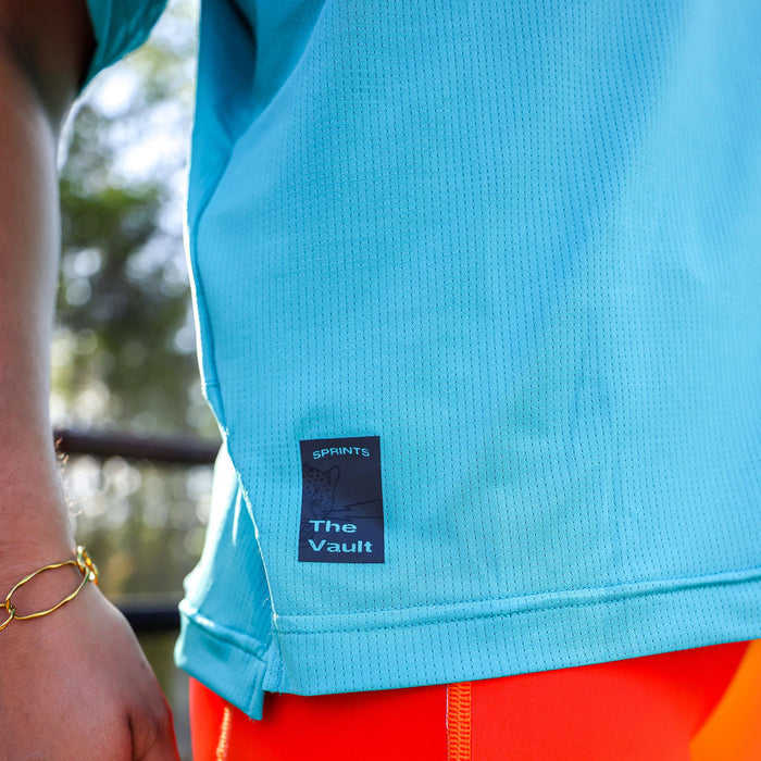 Woman wearing the Core Zero Tech Tee in Vault Jag Teal, close-up