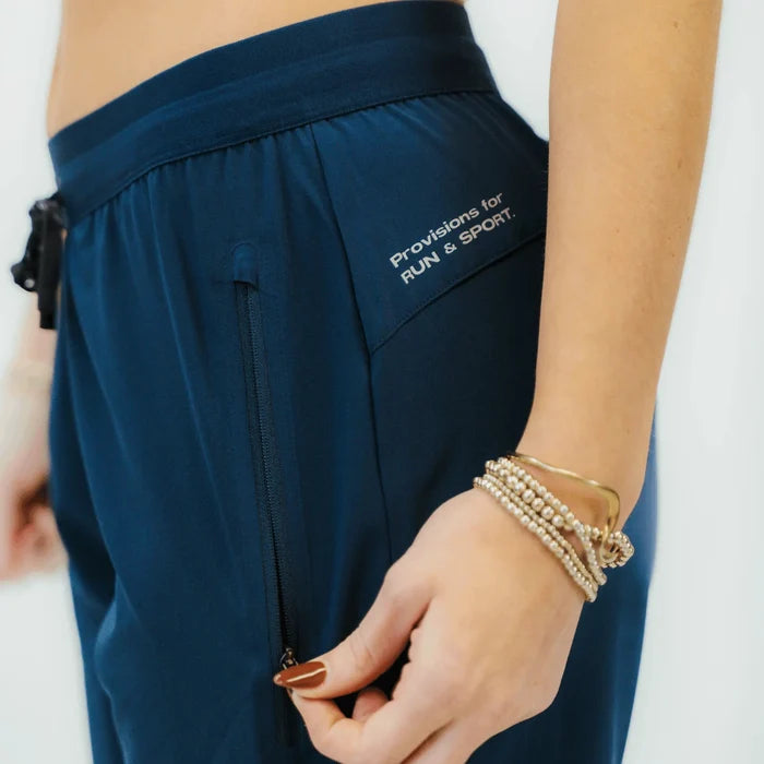 Woman wearing the Echelon Jogger in Stealth Navy