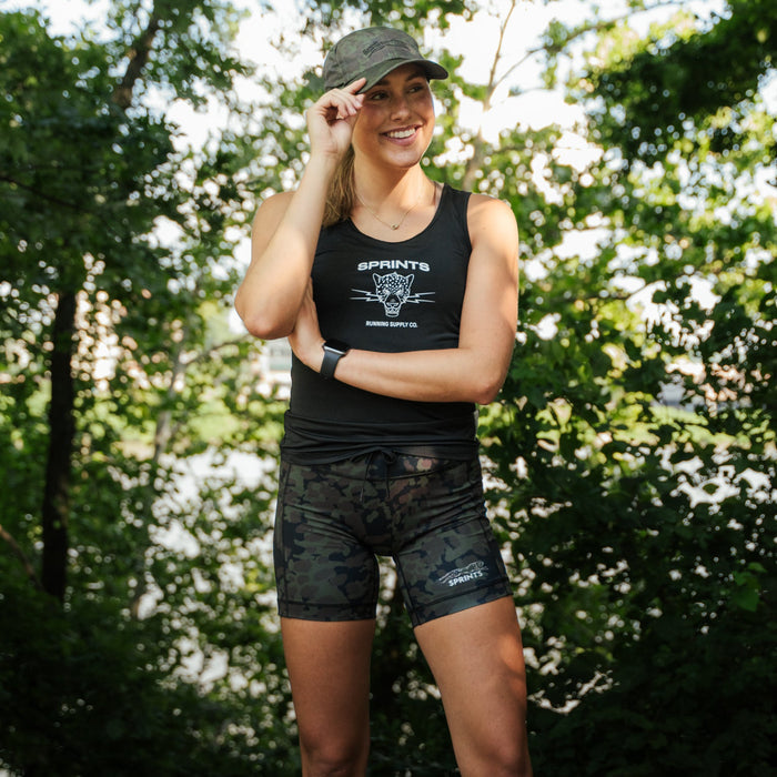 Woman wearing the Flexion 5 inch Compression Short in The Range Camo, side view