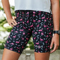 Woman wearing the Flexion 8 inch Compression Short in Find the Fauxmingo Black