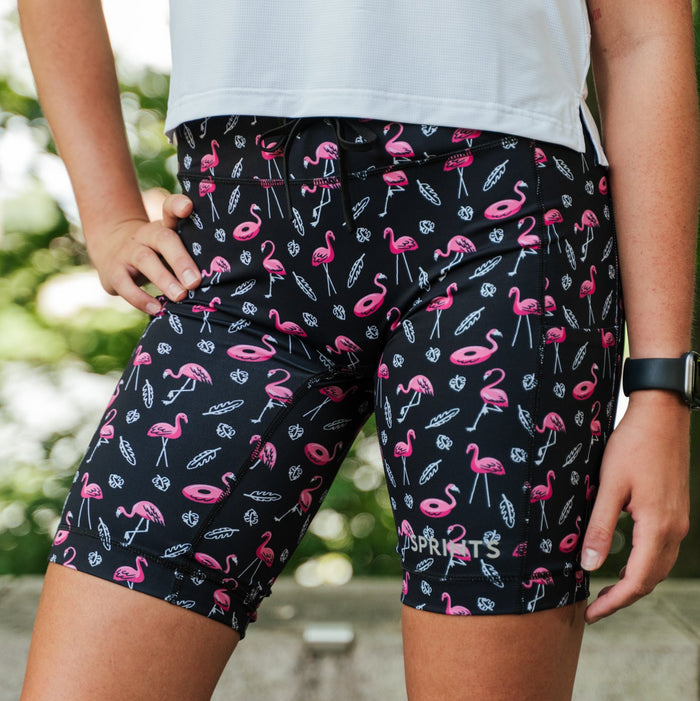 Woman wearing the Flexion 8 inch Compression Short in Find the Fauxmingo Black