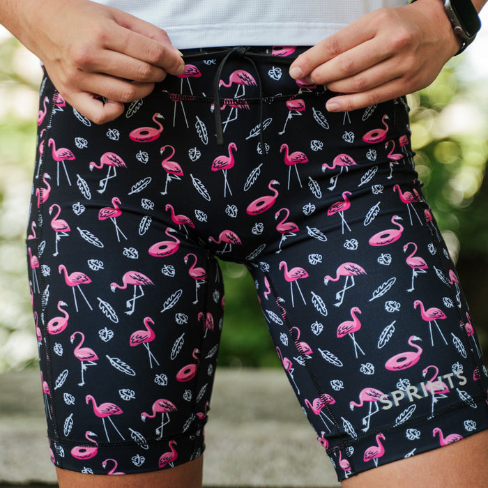 Woman wearing the Flexion 8 inch Compression Short in Find the Fauxmingo Black, close-up