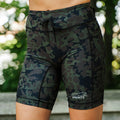 Woman wearing the Flexion 8 inch Compression Short in The Range Camo