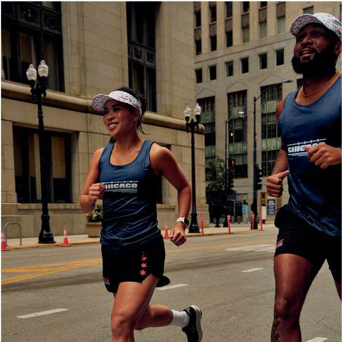 Woman wearing the Chicago Four Star Blue Running Tank