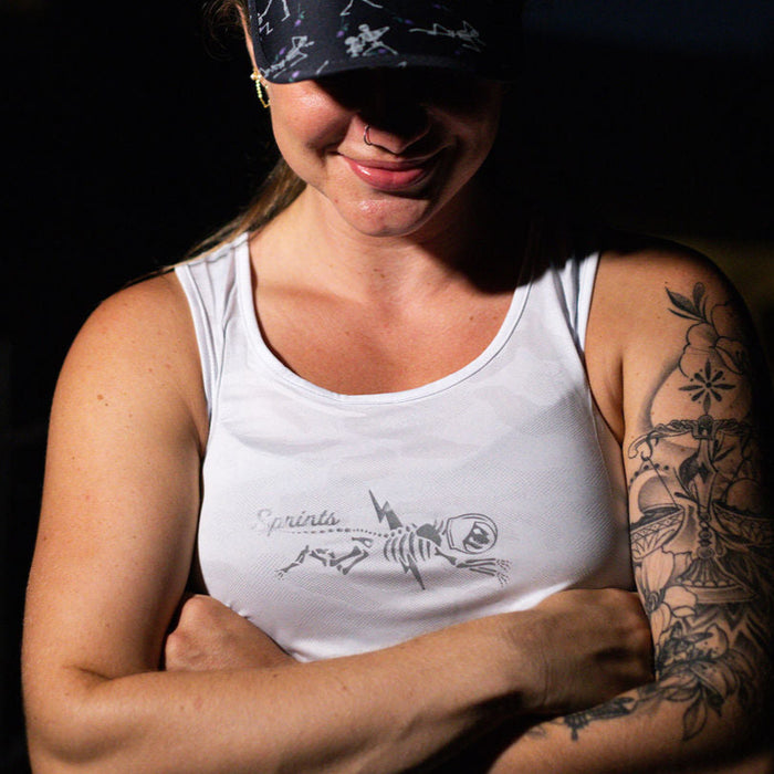Woman wearing the Shock Beast Miles Flash Reflective Running Tank